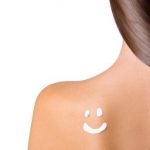 suntan cream smiley on shoulder