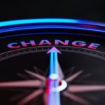 Change-Concept-Arrow-of-A-Compass-Pointing-Change-Text-Stock-image