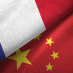 China and France two flags together realations textile cloth fabric texture